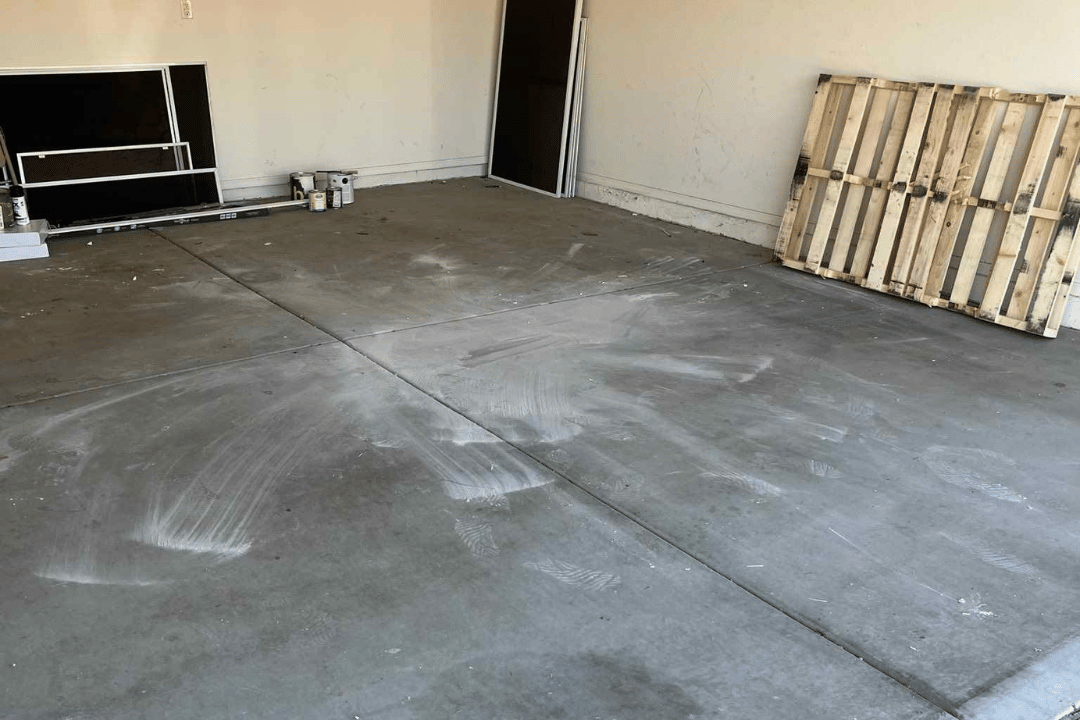 picture after junk removal service performed in Peoria, AZ of a garage floor with junk removed, showing a clean garage with garage space reclaimed